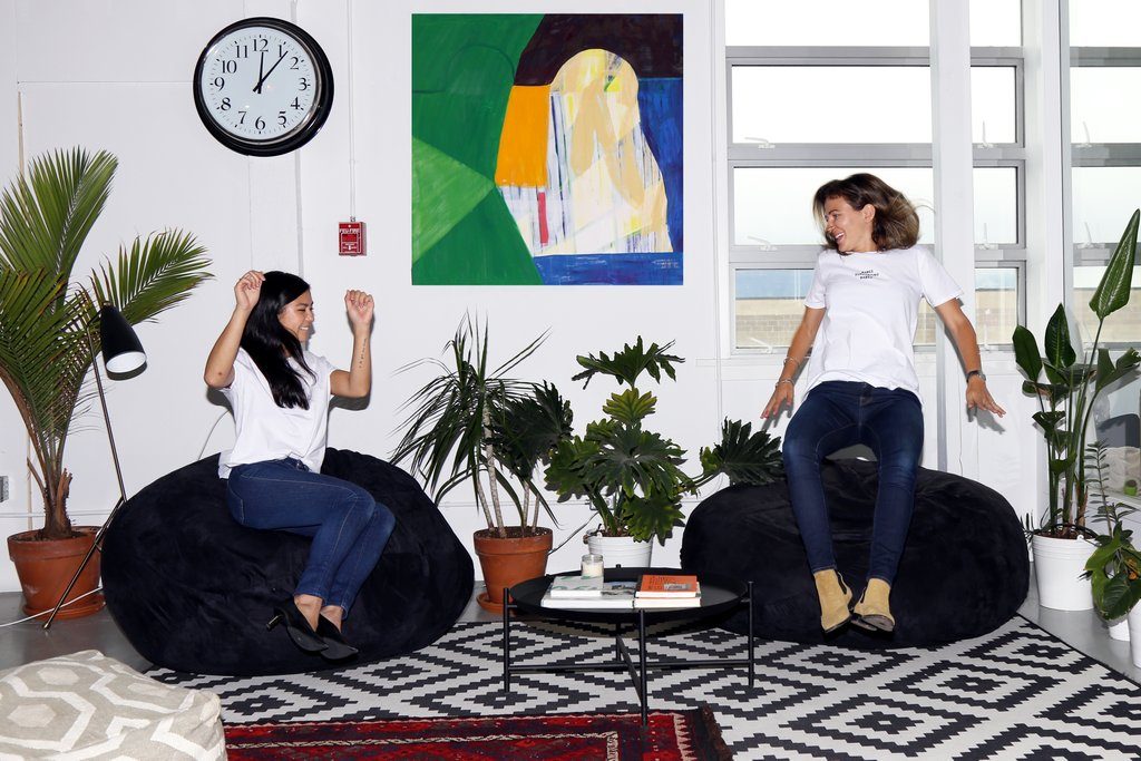 Courtney and Christina photographed jumping onto bean bag chairs at Werklab in Vancouver.