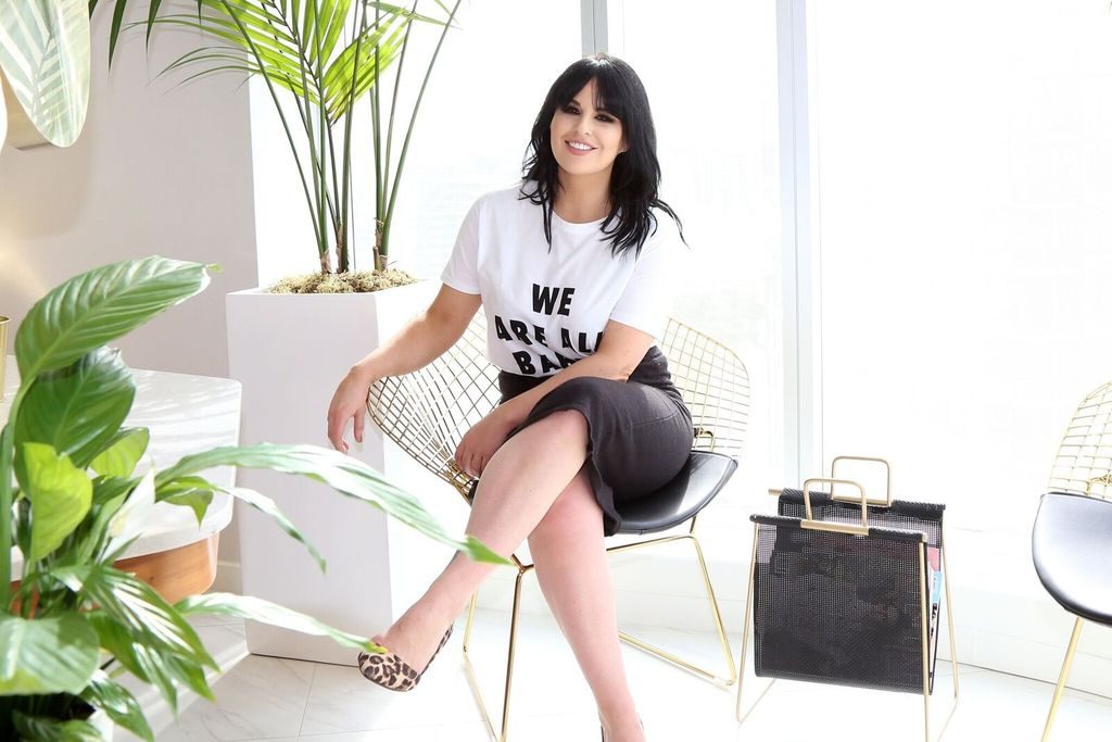 Female entrepreneur and founder of The Glamoury AJ Woodworth is photographed wearing the We Are All Babes Crew Neck Tee by Brunette the Label.