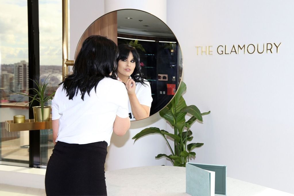 AJ Woodworth is photographed doing her lipstick at The Glamoury in Vancouver.
