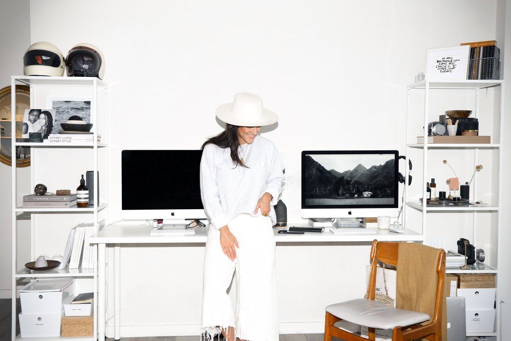 Female entrepreneur Britney Gill is photographed standing at her desk at her home in Vancouver.