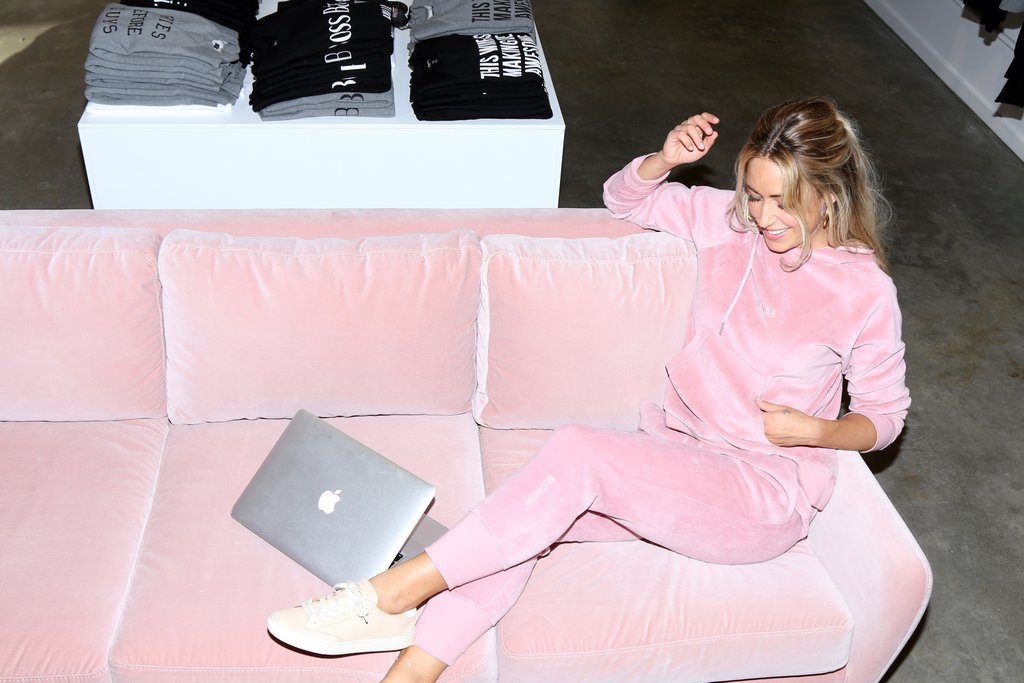 Female entrepreneur and blogger Cara Jourdan is photographed sitting on the couch of the Brunette Flagship Store in Vancouver.