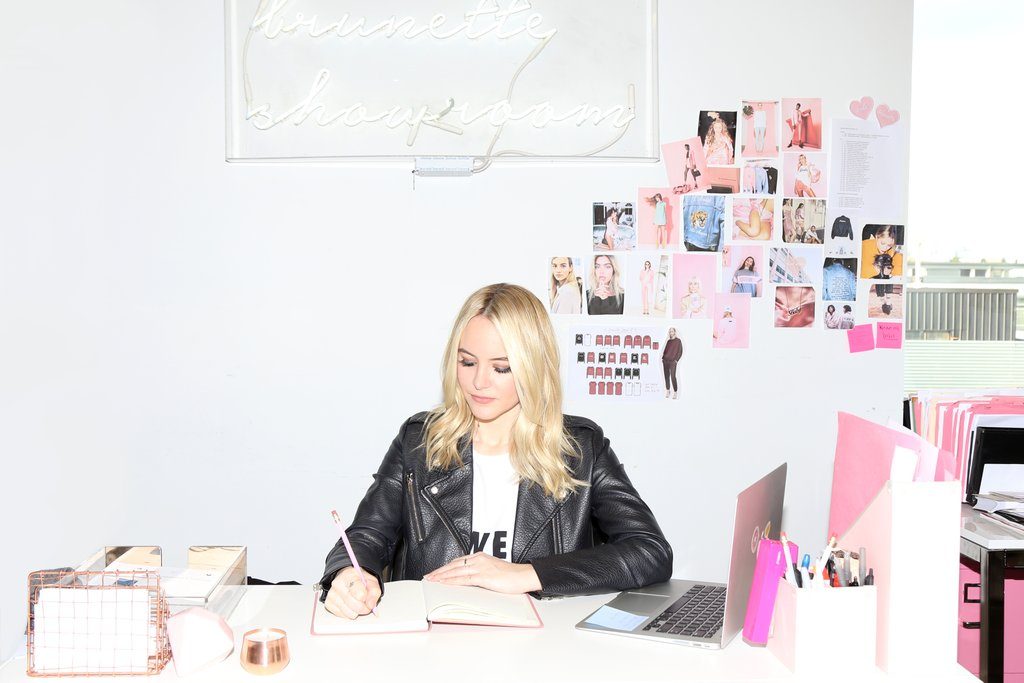 Chloe Claus is photographed working at her desk at Brunette Showroom in Vancouver.
