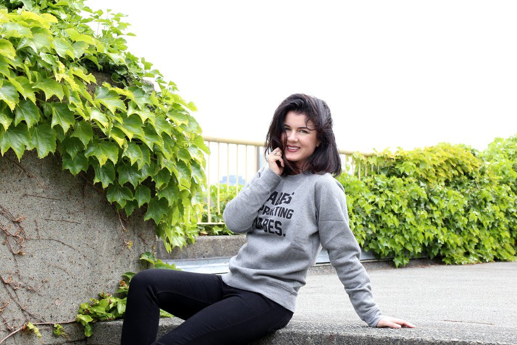 Gabrielle Miller is photographed wearing the Babes Supporting Babes Crew Neck Sweatshirt by Brunette the Label.
