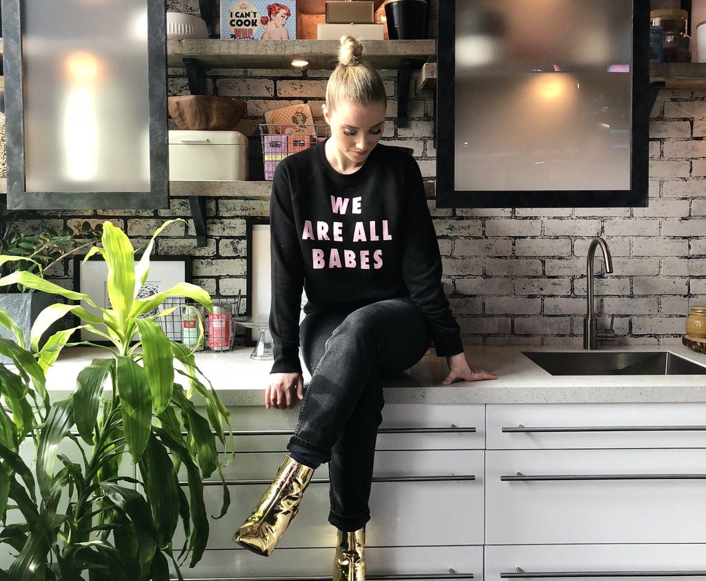 Liz Trinnear of CTV's etalk is photographed wearing the We Are All Babes Crew Neck Sweatshirt by Brunette the Label.