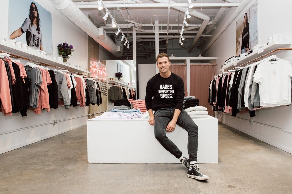 Ryan Pugsley is photographed sitting in the Brunette the Label Flagship Store in Vancouver.
