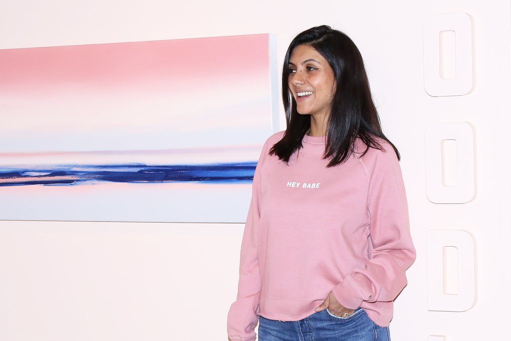 Beauty industry entrepreneur Sonia Chhinji of Woodlot is photographed smiling and wearing Brunette the Label.