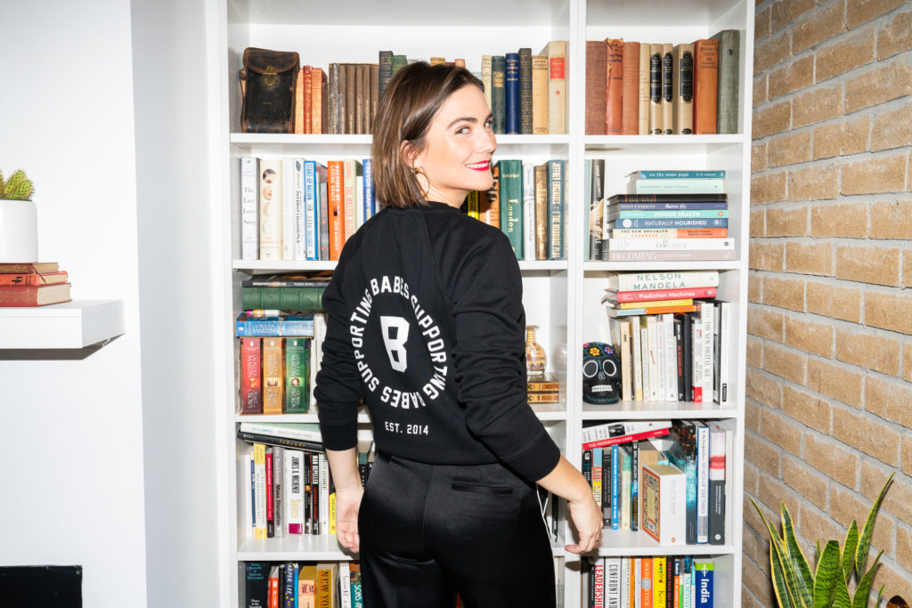 Emily Ramshaw of the Bumble dating app is photographed wearing the "BABES SUPPORTING BABES" Little Sister Crew Neck Sweatshirt by Brunette the Label.