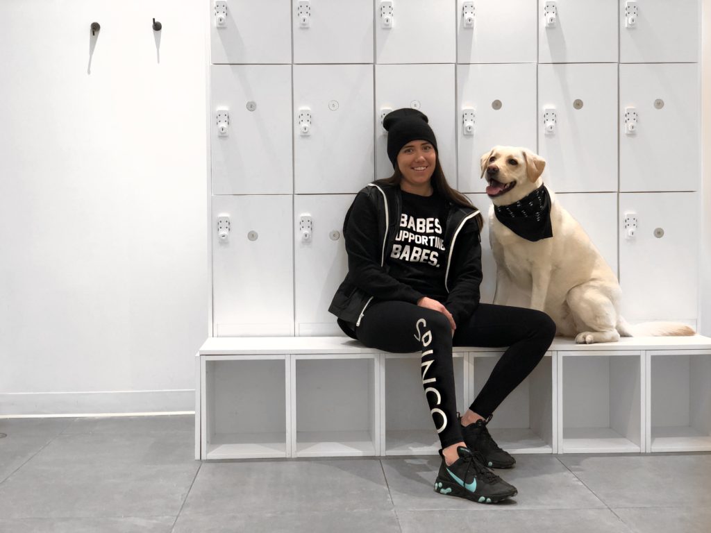 Michelle August the female founder of SPINCO is photographed with her dog.