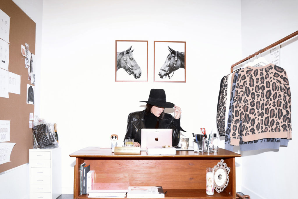 Female founder Miriam Alden of Brunette the Label, Brunette Showroom and The Babe List is photographed sitting in her Vancouver office.