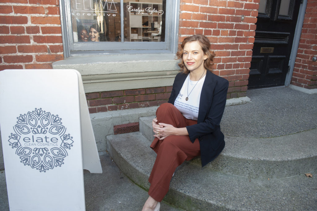 The female founder of Elate Cosmetics Melodie Reynolds, is photographed in front of her store in Victoria, BC.