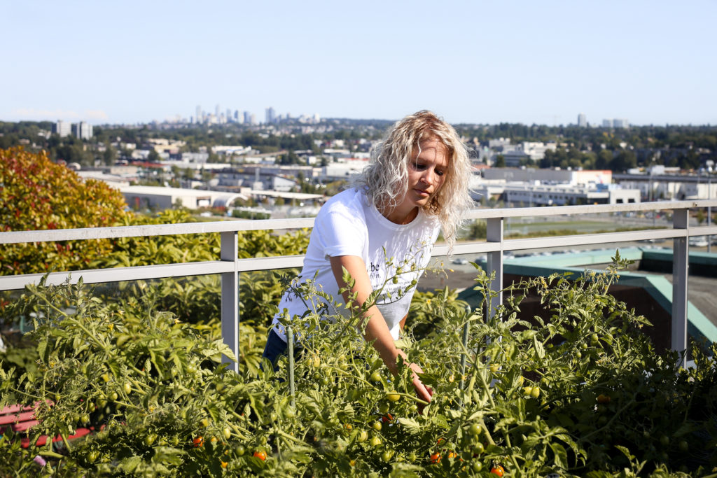 Michelle Davis, the Vice President of Community and Strategic Partnerships at lululemon is photographed working in her garden at her home in Vancouver.