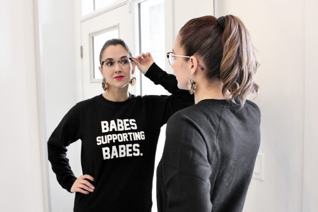 A photograph of female entrepreneur Selina Gray wearing the Babes Supporting Babes Classic Crew Neck Sweatshirt by Brunette the Label.