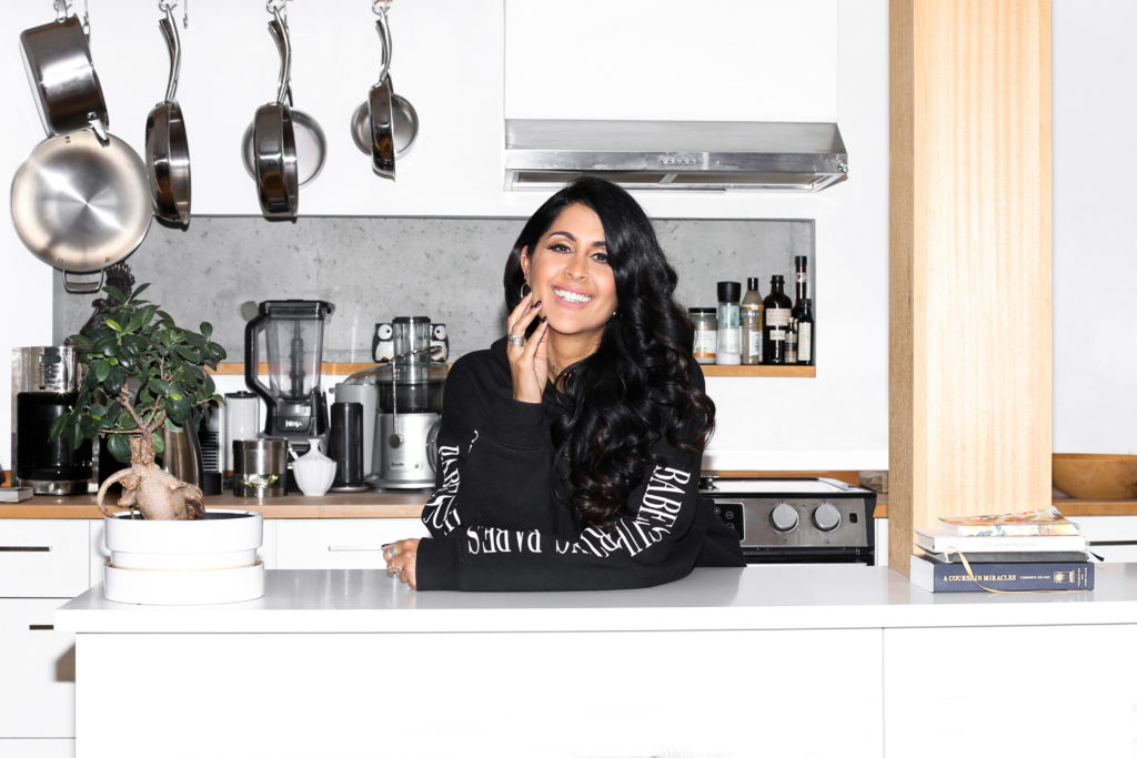 Female entrepreneur Tonia Mattu of Yuology is photographed standing her kitchen in Vancouver wearing Brunette the Label.