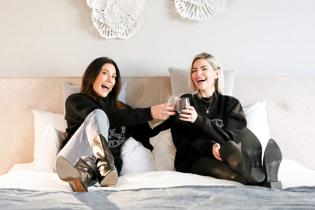 Sarah Nicole Landry of The Birds Papaya platform is photographed sitting with female entrepreneur Miriam Alden for The Babe List.